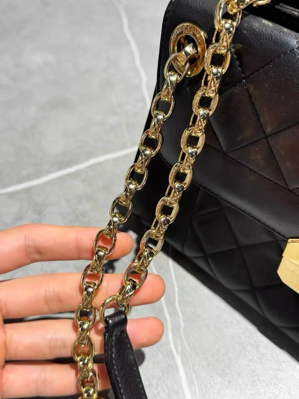 CHANEL Black Quilted Leather Shoulder Bag with Gold Hardware
